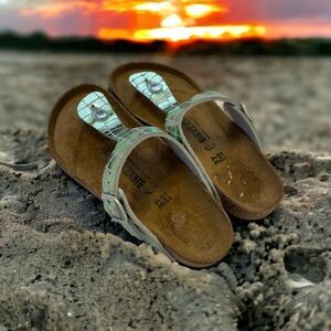 Shiny green Birkenstocks